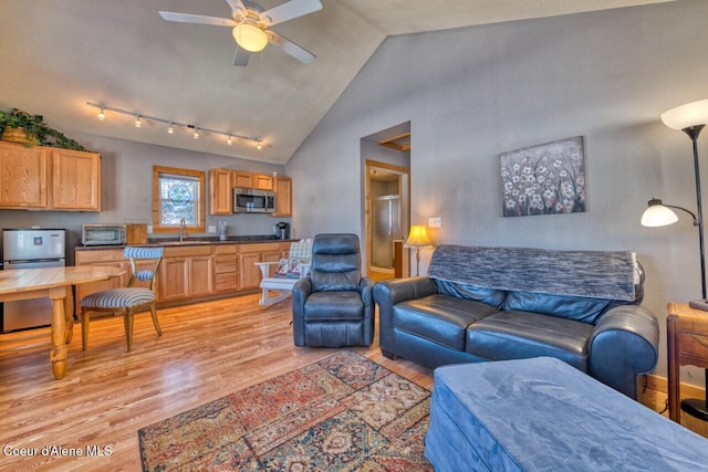 348 Kootenai Trail Rd, Naples, ID 83847 - living room with light wood-type flooring, a ceiling fan, and high vaulted ceiling