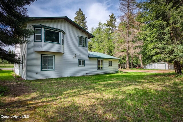 348 Kootenai Trail Rd, Naples, ID 83847 - back of house featuring a lawn