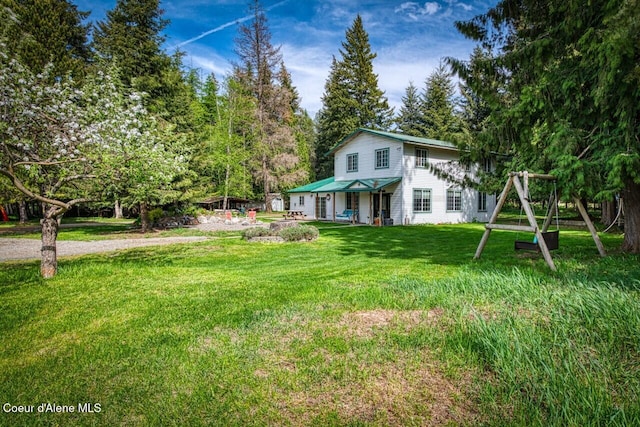 348 Kootenai Trail Rd, Naples, ID 83847 - view of front facade with a front yard and view of scattered trees