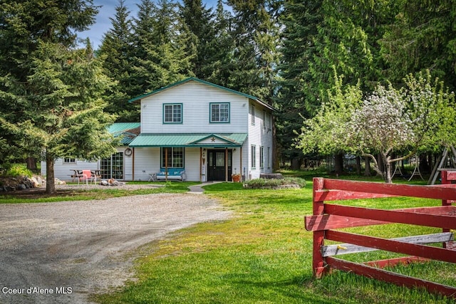 348 Kootenai Trail Rd, Naples, ID 83847 - view of front facade featuring a porch, a front yard, and driveway