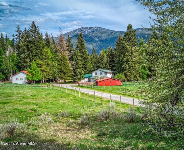 348 Kootenai Trail Rd, Naples, ID 83847 - view of yard featuring a mountain view, a view of trees, an outdoor structure, and a view of rural / pastoral area