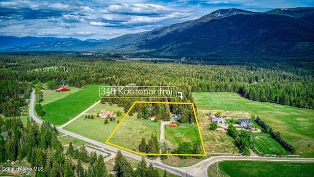 348 Kootenai Trail Rd, Naples, ID 83847 - aerial overview of property's location with a heavily wooded area, mountains, and property boundaries highlighted