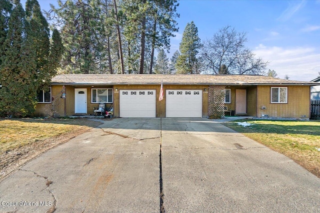 2707-2709 N 10th St, Coeur Dalene, ID 83815 - ranch-style home featuring an attached garage, concrete driveway, and a front lawn