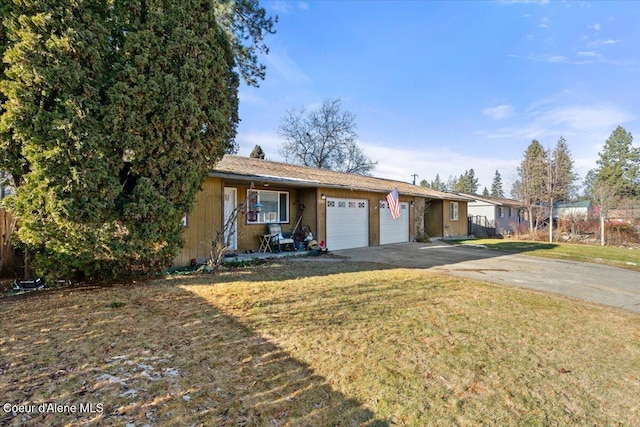 2707-2709 N 10th St, Coeur Dalene, ID 83815 - ranch-style house featuring an attached garage, concrete driveway, and a front lawn