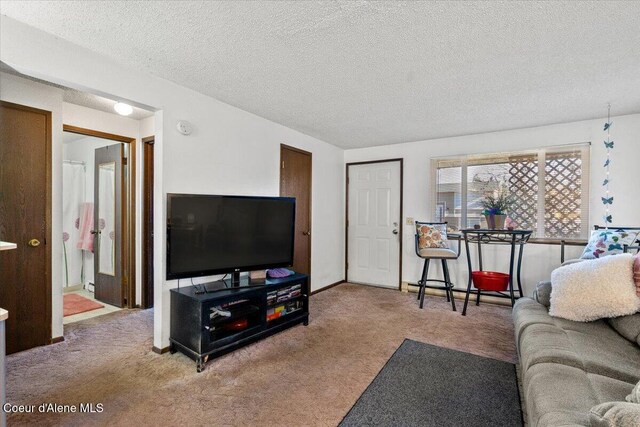 2707-2709 N 10th St, Coeur Dalene, ID 83815 - carpeted living room featuring a textured ceiling