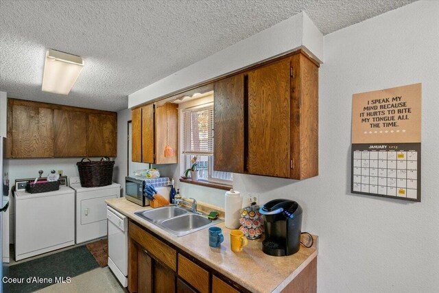 2707-2709 N 10th St, Coeur Dalene, ID 83815 - kitchen with washer and clothes dryer, stainless steel microwave, a sink, white dishwasher, and a textured ceiling