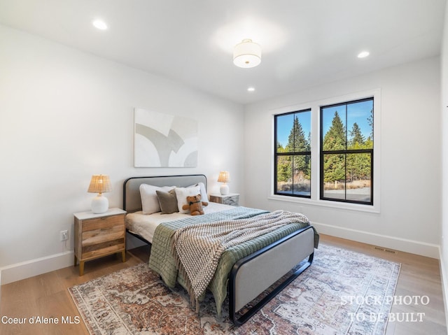 L2B5 E Winray Dr, Hayden, ID 83835 - bedroom with baseboards, wood finished floors, and recessed lighting