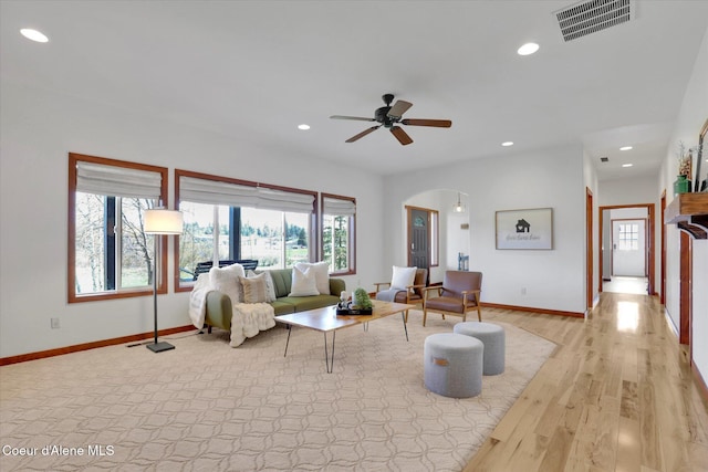 320 S River St, Rockford, WA 99030 - living area featuring baseboards, healthy amount of natural light, recessed lighting, and arched walkways