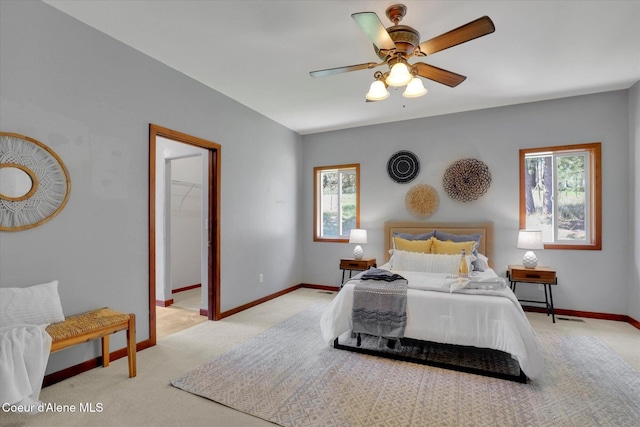 320 S River St, Rockford, WA 99030 - carpeted bedroom featuring multiple windows, baseboards, and a ceiling fan