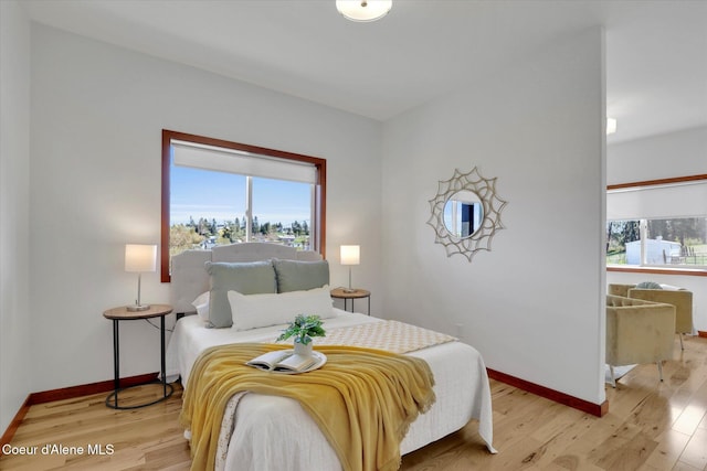 320 S River St, Rockford, WA 99030 - bedroom with multiple windows, light wood finished floors, and baseboards