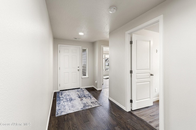 18924 E Fredrick Ave, Otis Orchards, WA 99027 - entryway with wood finished floors, baseboards, and a textured ceiling