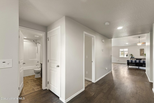 18924 E Fredrick Ave, Otis Orchards, WA 99027 - corridor featuring a textured ceiling, dark wood-type flooring, recessed lighting, and baseboards