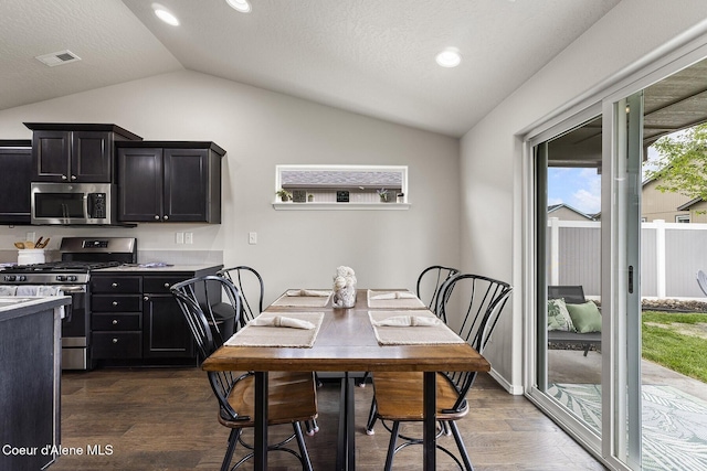 18924 E Fredrick Ave, Otis Orchards, WA 99027 - dining space with lofted ceiling, dark wood-style floors, and recessed lighting