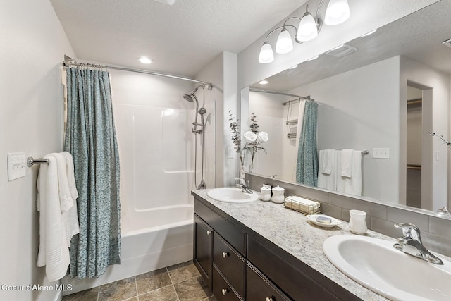 18924 E Fredrick Ave, Otis Orchards, WA 99027 - bathroom with a textured ceiling, double vanity, shower / tub combo with curtain, a spacious closet, and recessed lighting