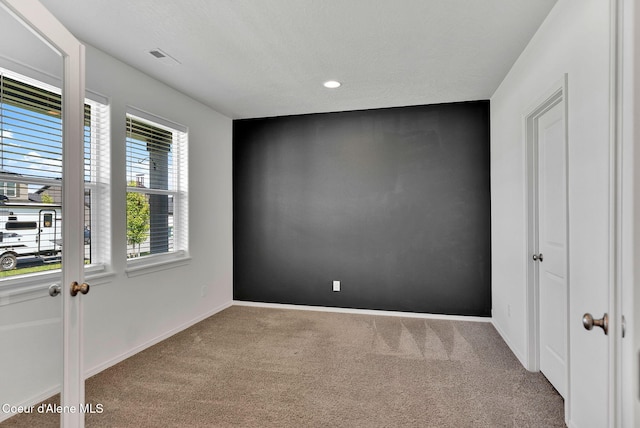 6314 Irish Dr, Rathdrum, ID 83858 - spare room featuring carpet floors, baseboards, recessed lighting, and a textured ceiling