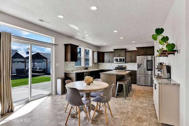 6314 Irish Dr, Rathdrum, ID 83858 - dining area with recessed lighting and a textured ceiling