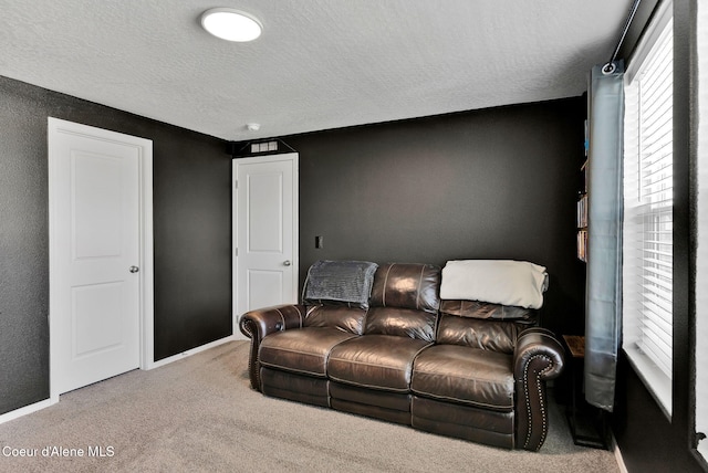 6314 Irish Dr, Rathdrum, ID 83858 - carpeted home theater room with a textured ceiling and baseboards