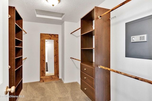 6314 Irish Dr, Rathdrum, ID 83858 - walk in closet featuring carpet floors and attic access