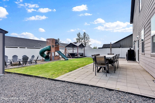 6314 Irish Dr, Rathdrum, ID 83858 - view of patio featuring a playground, an outdoor fire pit, outdoor dining space, and a gazebo