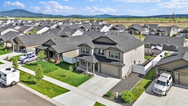6314 Irish Dr, Rathdrum, ID 83858 - aerial perspective of suburban area with a mountainous background