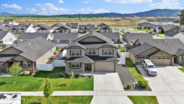 6314 Irish Dr, Rathdrum, ID 83858 - aerial perspective of suburban area with a mountainous background