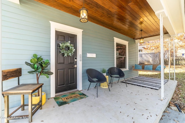 doorway to property featuring a porch