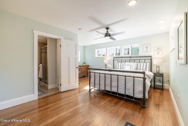 bedroom with wood finished floors and baseboards