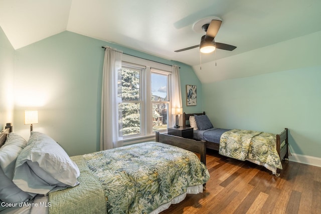 bedroom with lofted ceiling, wood finished floors, a ceiling fan, and baseboards