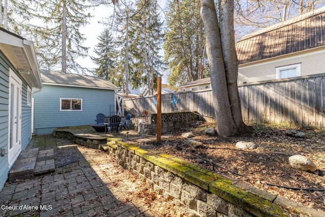 view of yard with fence and a patio