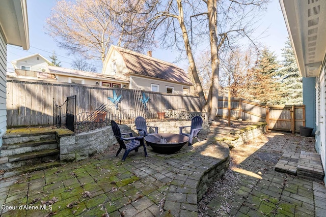 view of patio / terrace with a fire pit and a fenced backyard