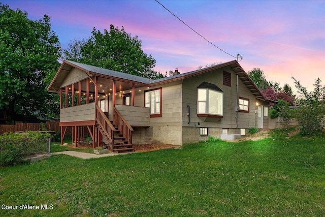 342 Summit Blvd, Priest River, ID 83856 - back of house featuring stairs, a chimney, and a sunroom