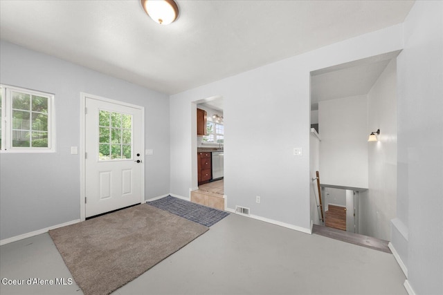 342 Summit Blvd, Priest River, ID 83856 - foyer entrance featuring baseboards and concrete floors