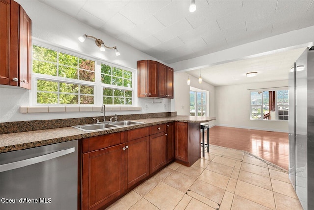 342 Summit Blvd, Priest River, ID 83856 - kitchen with stainless steel appliances, a sink, open floor plan, and healthy amount of natural light