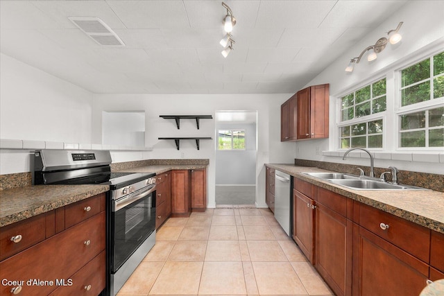342 Summit Blvd, Priest River, ID 83856 - kitchen featuring appliances with stainless steel finishes, a sink, track lighting, baseboards, and light tile patterned floors