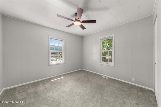 342 Summit Blvd, Priest River, ID 83856 - carpeted empty room with healthy amount of natural light, a ceiling fan, and baseboards