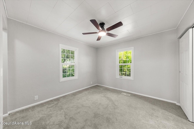 342 Summit Blvd, Priest River, ID 83856 - spare room featuring plenty of natural light, carpet flooring, ceiling fan, and baseboards