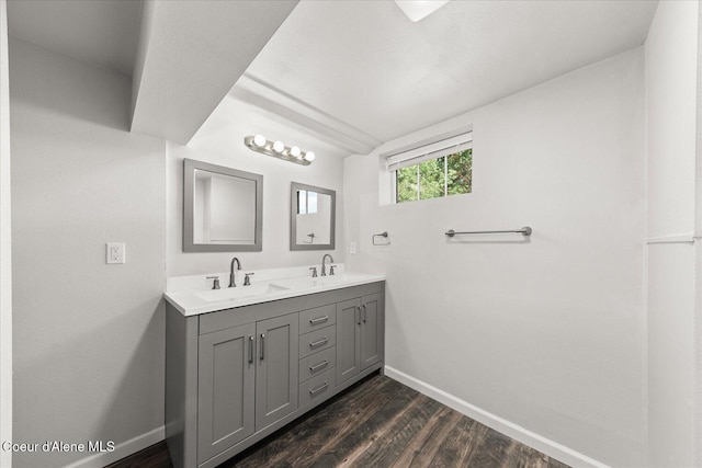 342 Summit Blvd, Priest River, ID 83856 - bathroom featuring baseboards, wood finished floors, and double vanity