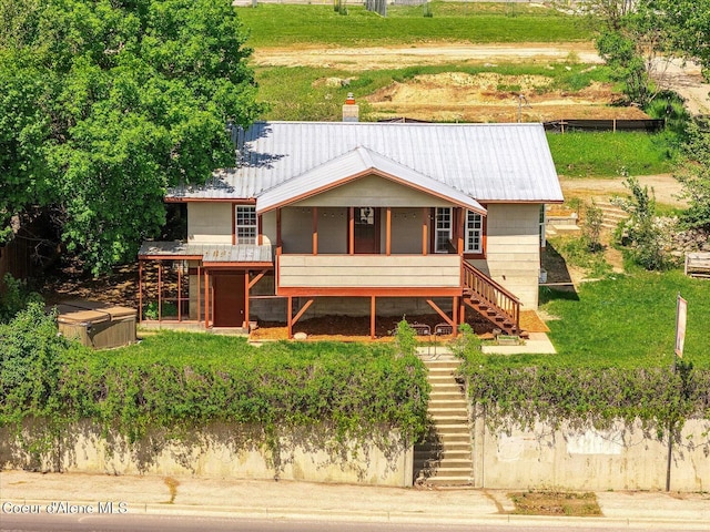 342 Summit Blvd, Priest River, ID 83856 - rear view of property featuring stairs, metal roof, a sunroom, and a chimney