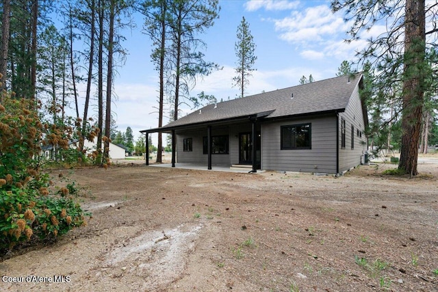 2060 E Plaza Ct, Post Falls, ID 83854 - back of property with a shingled roof and a patio
