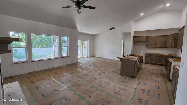 2060 E Plaza Ct, Post Falls, ID 83854 - kitchen with lofted ceiling, ceiling fan, open floor plan, and recessed lighting