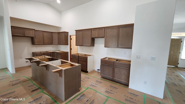 2060 E Plaza Ct, Post Falls, ID 83854 - kitchen featuring high vaulted ceiling and a kitchen island
