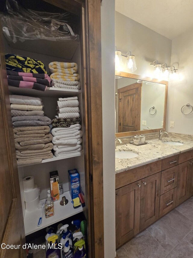 12552 N Walden Loop, Rathdrum, ID 83858 - full bathroom featuring double vanity and tile patterned floors