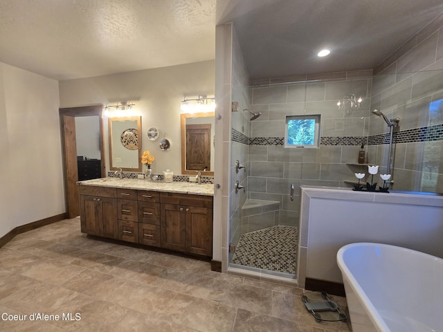 12552 N Walden Loop, Rathdrum, ID 83858 - full bath with a shower stall, a soaking tub, double vanity, and baseboards