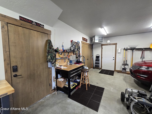 12552 N Walden Loop, Rathdrum, ID 83858 - entrance foyer with a workshop area and concrete floors