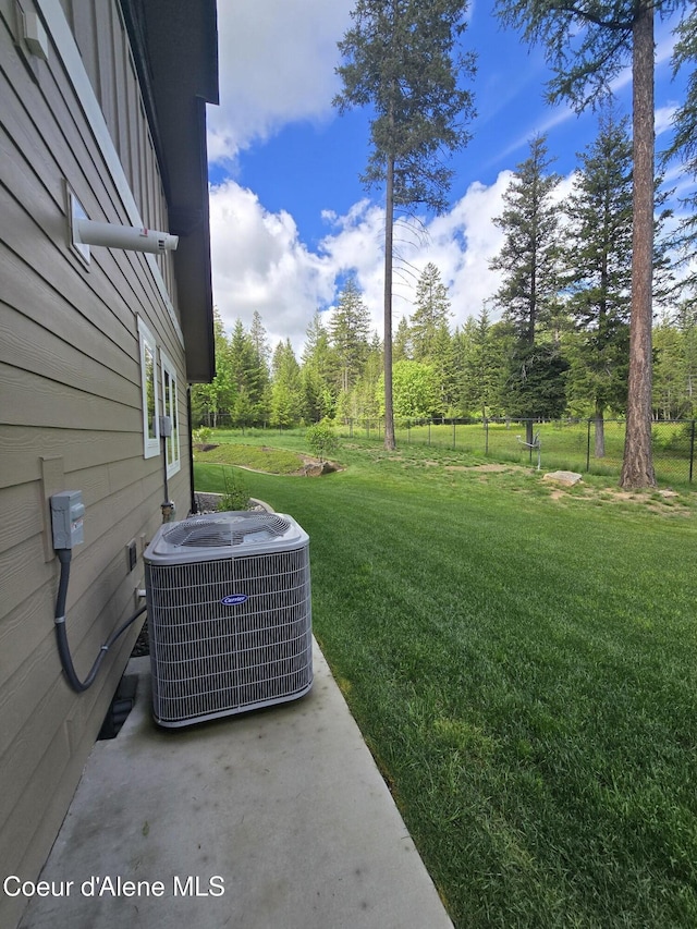 12552 N Walden Loop, Rathdrum, ID 83858 - view of green lawn featuring central AC unit and view of wooded area