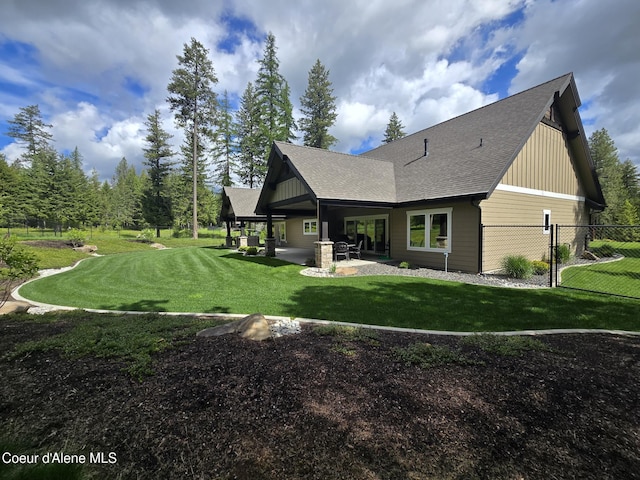 12552 N Walden Loop, Rathdrum, ID 83858 - rear view of house with a patio area, board and batten siding, and a shingled roof