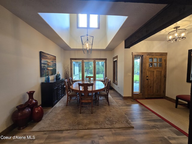 12552 N Walden Loop, Rathdrum, ID 83858 - dining room with baseboards, wood finished floors, and a chandelier