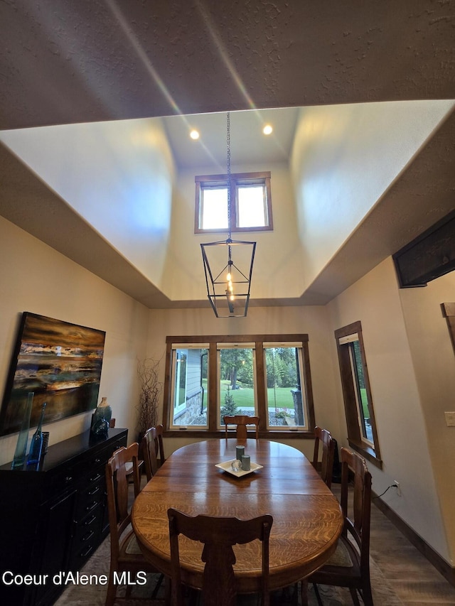 12552 N Walden Loop, Rathdrum, ID 83858 - dining room with a high ceiling, recessed lighting, and baseboards
