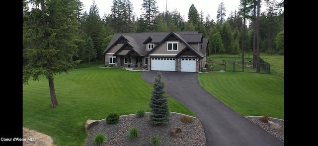 12552 N Walden Loop, Rathdrum, ID 83858 - craftsman-style house with asphalt driveway, a garage, and stone siding