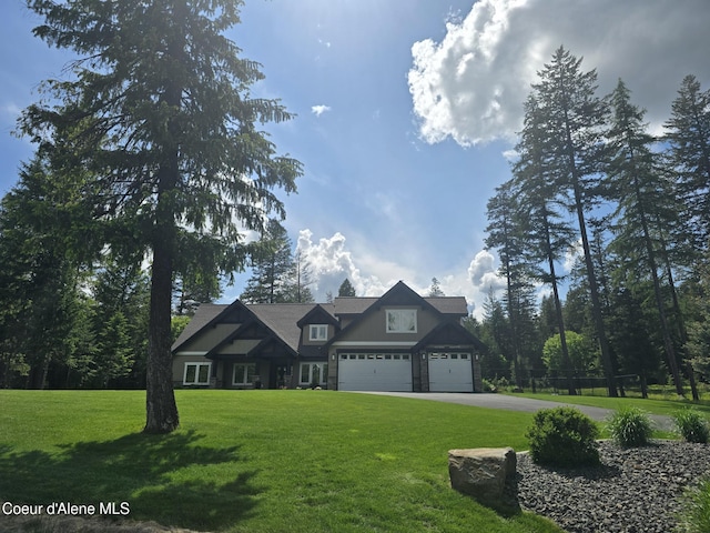 12552 N Walden Loop, Rathdrum, ID 83858 - craftsman house featuring a front lawn, driveway, and an attached garage